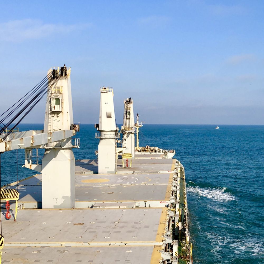 Picture of the deck of a G2 Ocean owned open hatch shipping vessel sailing