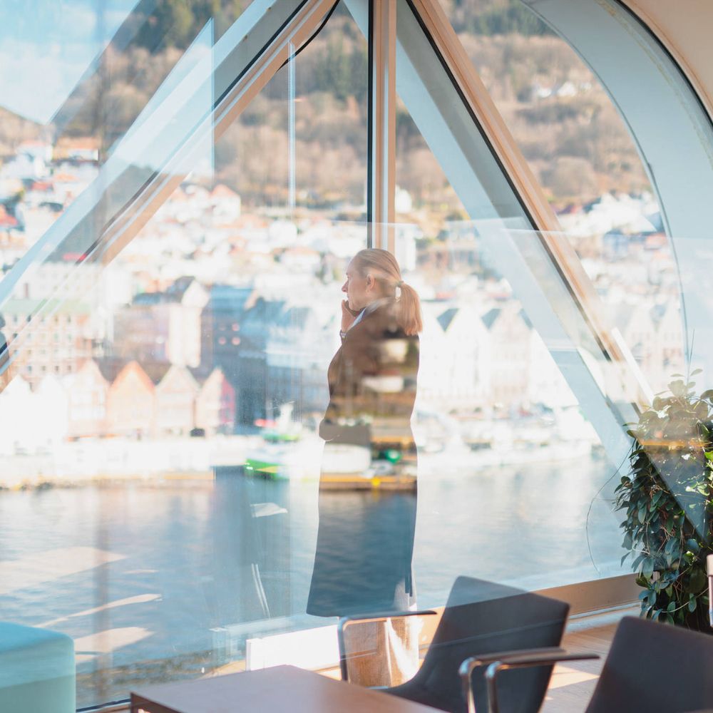 Picture of woman talking in her phone at G2 Ocean's Bergen office